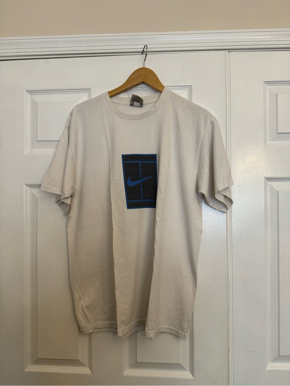 Nike Short Sleeve Cream Tee with Blue Logo Graphic